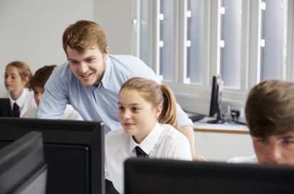 Teacher showing student information on computer