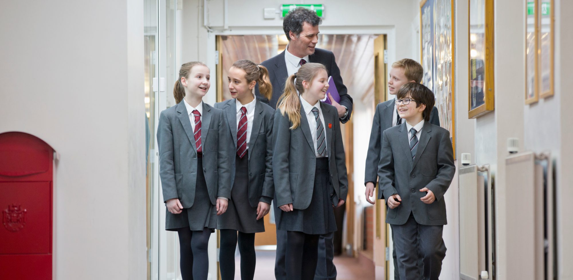 Principal talking to school students | AI policy in schools