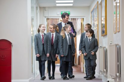 Principal talking to school students | AI policy in schools