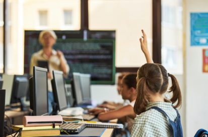 child raising hand during class | school data breach